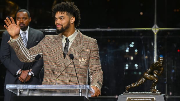 Caleb Williams reacts after winning the Heisman Trophy.